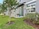 Well-maintained backyard featuring a patio, healthy lawn, and privacy fence, great for relaxing outdoors at 2717 Chestnut Creek Pl, Brandon, FL 33510