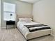 This bedroom features a plush bed, soft carpet, and a bedside table with a stylish lamp at 2717 Chestnut Creek Pl, Brandon, FL 33510
