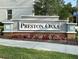 Attractive Preston Oaks community sign with colorful flower beds adding curb appeal at 2717 Chestnut Creek Pl, Brandon, FL 33510
