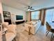 Open-concept living room with a comfortable sofa, modern decor, and stylish furniture at 2717 Chestnut Creek Pl, Brandon, FL 33510