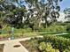 Picturesque walking path surrounded by lush greenery and mature trees offering a serene environment at 2717 Chestnut Creek Pl, Brandon, FL 33510