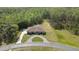 Aerial view of a well maintained home with a large drive and circular drive at 27338 Elkwood Cir, Wesley Chapel, FL 33544