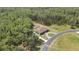 Beautiful single-story home nestled on a large lot featuring mature trees, lush lawn, and a private driveway at 27338 Elkwood Cir, Wesley Chapel, FL 33544