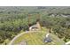 Aerial view showcasing this luxury home surrounded by lush greenery, highlighting the property's privacy and serene setting at 27338 Elkwood Cir, Wesley Chapel, FL 33544