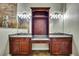 Elegant bathroom featuring dual sinks, granite countertops, wood cabinets, and a large walk-in shower with stone surround at 27338 Elkwood Cir, Wesley Chapel, FL 33544