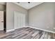 Bedroom with hardwood floors and large closet at 27338 Elkwood Cir, Wesley Chapel, FL 33544