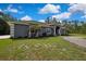 Tastefully designed single-story home showcasing stone column accents and neat landscaping at 27338 Elkwood Cir, Wesley Chapel, FL 33544