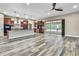 Spacious kitchen with stainless steel appliances, dark wood cabinets, island and views of the pool at 27338 Elkwood Cir, Wesley Chapel, FL 33544