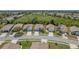 Neat suburban homes line the streets, complemented by verdant lawns and mature trees for a scenic community view at 2747 Wood Pointe Dr, Holiday, FL 34691