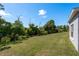 The large, green backyard provides ample space and privacy at 2747 Wood Pointe Dr, Holiday, FL 34691