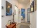 Inviting hallway with elegant decor, featuring wood floors and neutral walls at 2747 Wood Pointe Dr, Holiday, FL 34691