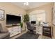 Cozy home office with a desk, storage, and a large window for ample natural light at 2747 Wood Pointe Dr, Holiday, FL 34691