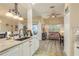 Modern kitchen with stainless sink, breakfast bar, and adjacent living area at 2747 Wood Pointe Dr, Holiday, FL 34691