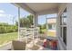 Relaxing screened lanai with table and chairs, perfect for enjoying the outdoors at 2747 Wood Pointe Dr, Holiday, FL 34691