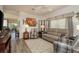 Inviting living room featuring hardwood floors, stylish furnishings, and abundant natural light at 2747 Wood Pointe Dr, Holiday, FL 34691