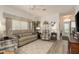 Inviting living room featuring a neutral color palette and wood-look flooring at 2747 Wood Pointe Dr, Holiday, FL 34691