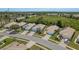Neighborhood street featuring well-maintained homes with manicured lawns and attached garages at 2747 Wood Pointe Dr, Holiday, FL 34691