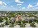 Aerial view of the community with lush landscaping and tree-lined streets at 3095 Riders Pass, Odessa, FL 33556