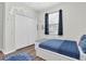 Bedroom featuring a large closet, window, and themed decor at 3095 Riders Pass, Odessa, FL 33556