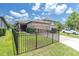 Well-maintained home with a two-car garage, landscaped yard, and a brick driveway at 3095 Riders Pass, Odessa, FL 33556