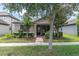 Lovely home exterior featuring a well-manicured lawn and neutral colors at 3095 Riders Pass, Odessa, FL 33556