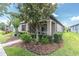 Inviting home exterior with a magnolia tree and lush, green landscaping at 3095 Riders Pass, Odessa, FL 33556