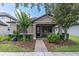 Charming single-story home with manicured landscaping and a welcoming front porch at 3095 Riders Pass, Odessa, FL 33556