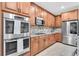Contemporary kitchen with a double oven, stainless steel appliances, and plenty of cabinet space at 3095 Riders Pass, Odessa, FL 33556
