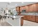 Modern kitchen featuring an island, stainless steel appliances, and stylish lighting at 3095 Riders Pass, Odessa, FL 33556