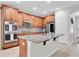 Gourmet kitchen featuring custom cabinetry, stainless steel appliances, and granite countertops at 3095 Riders Pass, Odessa, FL 33556