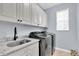 Laundry room with washer, dryer, and granite countertop at 3095 Riders Pass, Odessa, FL 33556