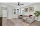 Comfortable living room with hardwood floors, modern furniture, and ample natural light at 3095 Riders Pass, Odessa, FL 33556