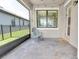 Covered patio with brick pavers and seating at 3095 Riders Pass, Odessa, FL 33556