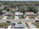 An aerial view shows a neighborhood with neat landscaping, diverse home styles and mature trees, presenting a welcoming atmosphere at 3104 W Powhatan Ave, Tampa, FL 33614