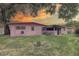 Spacious backyard at sunset, with lots of shade provided by mature trees at 3104 W Powhatan Ave, Tampa, FL 33614