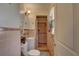 Cozy bathroom with tiled shower and open door to toilet and vanity is a functional and pleasing space at 3104 W Powhatan Ave, Tampa, FL 33614