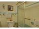 Vintage bathroom features a blue tub shower and sink adding character to the space at 3104 W Powhatan Ave, Tampa, FL 33614