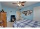 Inviting bedroom features a comfortable bed, entertainment center, and ample natural light at 3104 W Powhatan Ave, Tampa, FL 33614