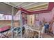 Enclosed patio features a table and chairs, leading to the backyard at 3104 W Powhatan Ave, Tampa, FL 33614