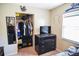 Bedroom featuring a walk-in closet, baseball themed design, and a black dresser at 3139 W Varn Ave, Tampa, FL 33611