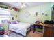 Bright bedroom with light green walls and a ceiling fan for a fresh, welcoming atmosphere at 3139 W Varn Ave, Tampa, FL 33611