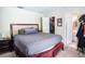 Bright bedroom showcasing neutral carpet, closet with open door, and access to the ensuite bathroom at 3139 W Varn Ave, Tampa, FL 33611