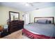 Bedroom with a comfortable carpet, ensuite and closet access, and modern ceiling fan at 3139 W Varn Ave, Tampa, FL 33611