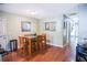 Dining room featuring a wooden table and chairs with wooden flooring at 3139 W Varn Ave, Tampa, FL 33611