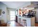 This eat-in kitchen features wood cabinets, a breakfast bar, and track lighting at 3139 W Varn Ave, Tampa, FL 33611