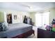 Spacious main bedroom with a walk-in closet, ensuite bathroom, and sliding doors at 3139 W Varn Ave, Tampa, FL 33611