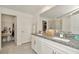 Modern bathroom with double sinks, granite counters, and walk-in closet at 3228 Bryant Park Dr, New Port Richey, FL 34655