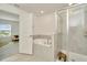 Well-lit bathroom with a soaking tub and frameless walk-in shower at 3228 Bryant Park Dr, New Port Richey, FL 34655