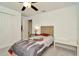 Cozy bedroom featuring a ceiling fan, closet, and neutral color scheme at 3228 Bryant Park Dr, New Port Richey, FL 34655
