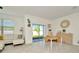 Bright dining area adjacent to the patio that features contemporary decor and room to gather at 3228 Bryant Park Dr, New Port Richey, FL 34655